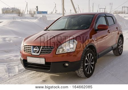 Nissan Qashqai in red color. This is crossover that combines modark design and compact hatchback refinement with functionality