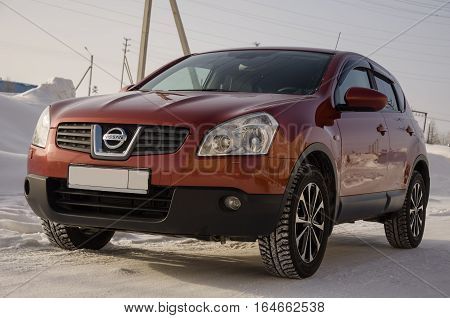 Nissan Qashqai in red color. This is crossover that combines modark design and compact hatchback refinement with functionality