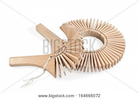 Wooden ethnic musical instruments - ratchet of the plates with two handles, isolated on a white background