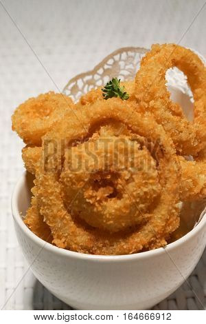 Fried onion rings crisp in a white cup plate deep fried