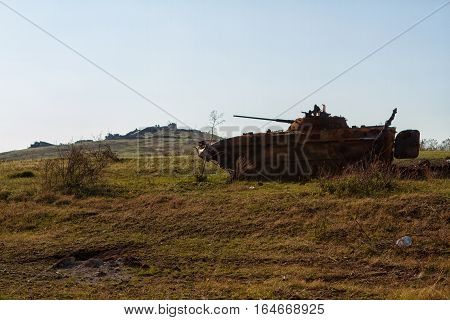 Ukrainian armored vehicles destroyed in the July fighting near the memorial at the top of the Saur-Graves
