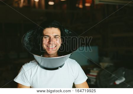 Male model wearing fooling around his neck reflector diffuser. Dog Recovery Collar Cones