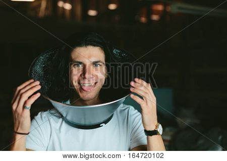Male model wearing fooling around his neck reflector diffuser. Dog Recovery Collar Cones
