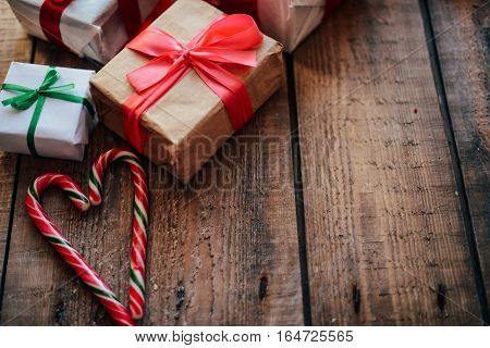 Valentine's Day Concept. Gift With Red Bow  On The Wooden Backgr
