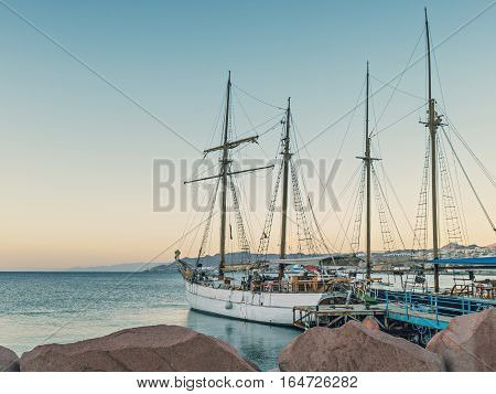 Moored pleasure yachts and boats in marina of Eilat, Israel.
View from cental beach on the Red sea.