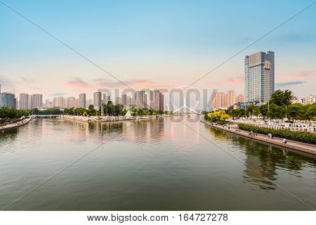 beautiful haihe river and ferris wheel at dusk in tianjin China