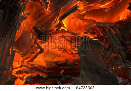 smoldering fire embers with the ashes background