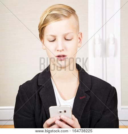 Teenager with phone in hands. Internet dependence computer games