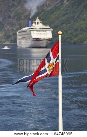 Norwegian flag. Norway fjord landscape with cruise. Travel background. Tourist