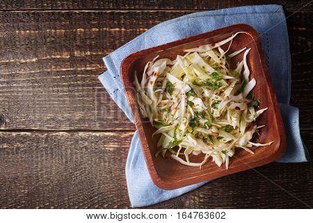 Cabbage salad on the wooden table top view