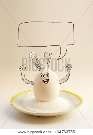 Nice egg banny on a saucer with hands smiling. Happy easter