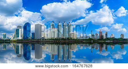 Cityscape image of Benchakitti Park at blue sky background in Bangkok Thailand.