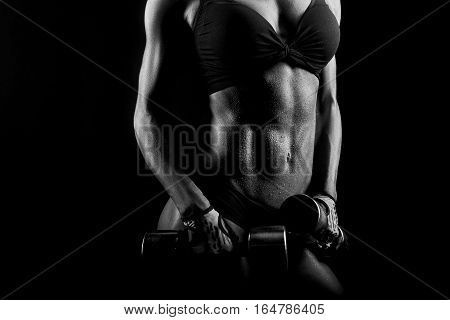 Goal worth sweating. Cropped closeup of a stunning muscular female torso of a fitness woman body wet after a hard workout