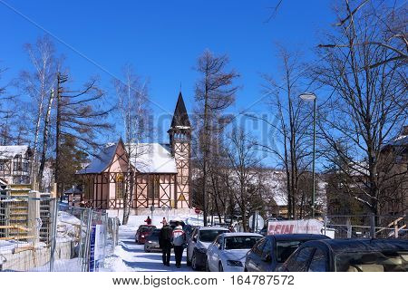 SLOVAKIA STARY SMOKOVEC - JANUARY 06 2015: Church of the Immaculate Conception. Is built in the alpine half-timbered neo-gothic style. The church was designed by the Gideon Majunke in 1888.