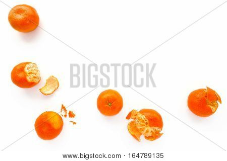 Closeup of Nadorcott Clementines on white as food background with lots of copy space.