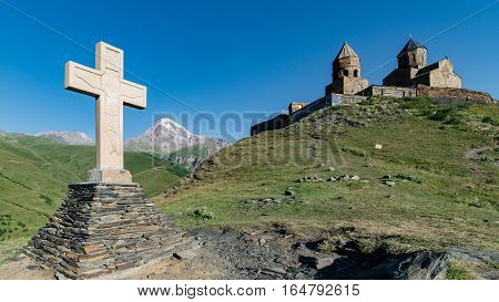 Gergeti, Georgia - August 5, 2015: The cross of the Gergeti Trinity Church