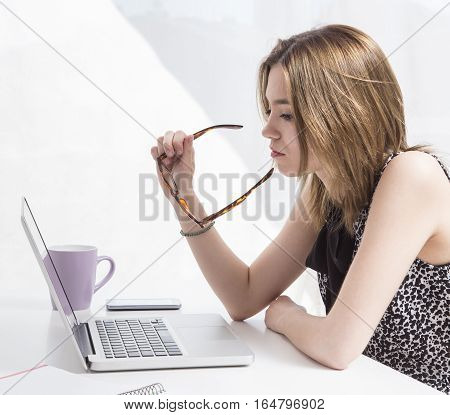 Young executive working in the office at the computer