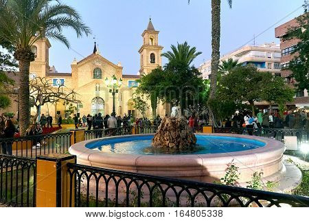 Torrevieja Spain - January 5 2017: Crowd of people in the Constitution square during Cavalcade of the Magi parade. It is one of the most popular squares in the Torrevieja city near it is the Church of the Immaculate Conception