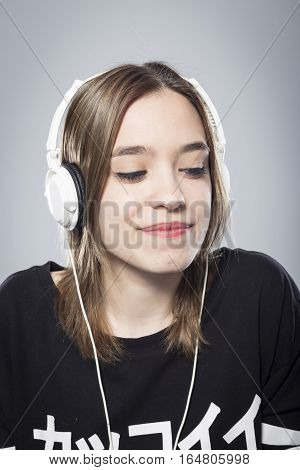 Happy girl listening to music with headphones