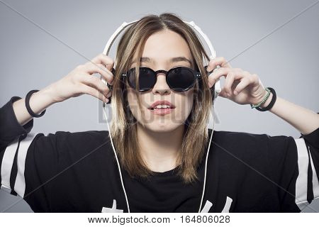 Happy girl listening to music with headphones