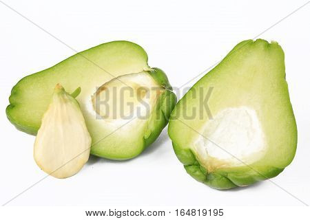 Chayote (Sechium edule) halved fruit isolated against white background