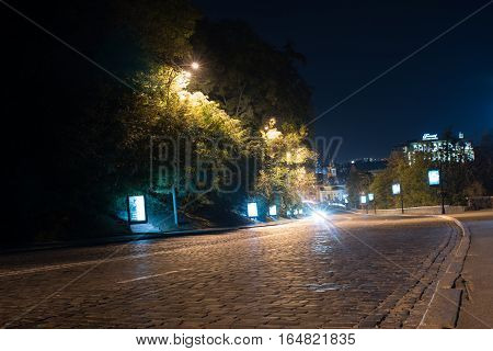 Bustle of the city, the road and the car on the bridge at night by the light