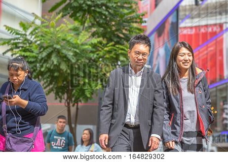 Hong Kong, China - December 6, 2016: asian couple walking for shopping in Jardine's Crescent street market, Causaway Bay, district full of luxury shops of famous brends.