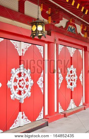 Bentendo temple's red doors in Tokyo Japan.