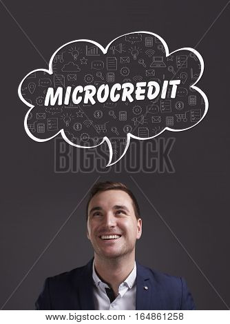 Business, Technology, Internet And Marketing. Young Businessman Thinking About: Microcredit