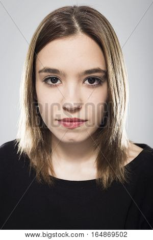Expressive portrait of girl with neutral background