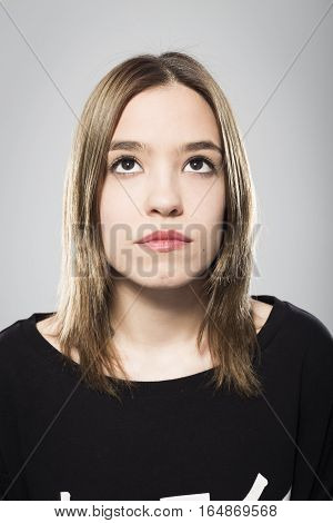 Expressive portrait of girl with neutral background