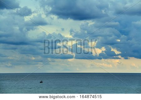 Seascape with fisherman boat in Mediterranean sea near shore of Tunisia