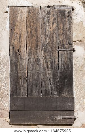 Old wooden door weathered by years in a medieval village