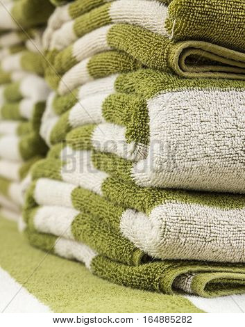 white and green towels on swimming pool