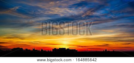 Colorful sunset with clouds over the city of Giurgiu, Romania.