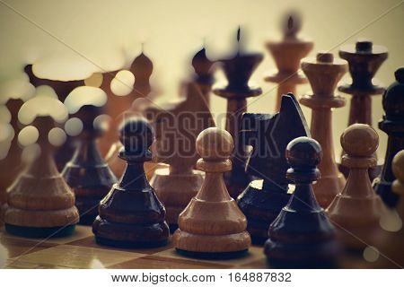 The image of a wooden games of chess.