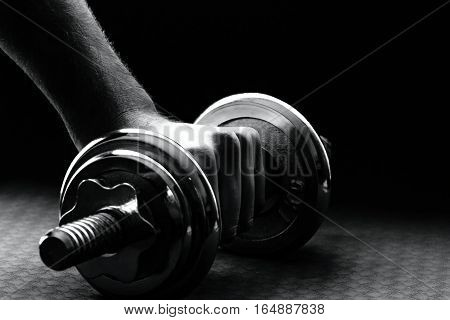 The human hand rising barbell with pads.