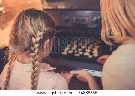 Mother And Daughter Baking