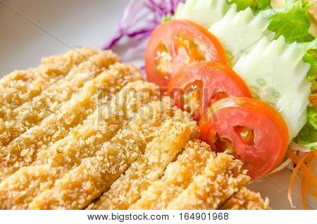 fried chicken in batter salad food on plate