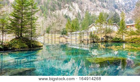 BLAUSEE KANDERGRUND SWITZERLAND - DECEMBER 18 2016:Blue Lake nature park in winter Kandersteg Switzerland.Paradise mountain landscape for tourist and traveler.