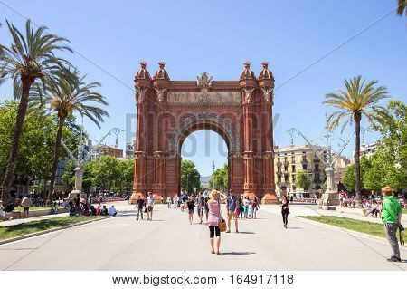 BARCELONA - MAY 21 2016: Tourists at the Arc de Triomf Parc in Barcelona Spain