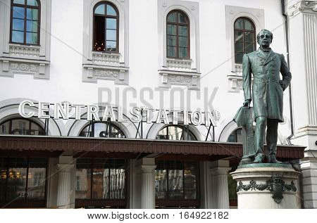 STOCKHOLM SWEDEN - AUGUST 19 2016: Statue of Nils Ericson in front of Stockholm Central Station and Stockholm Central Train Station in Stockholm Sweden on August 19 2016.