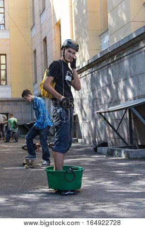 KAZAKHSTAN ALMATY - AUGUST 28, 2016: Urban extreme competition, where the city athletes compete in the disciplines: skateboard, roller skates, BMX. Bmx stunt performed at the top of a mini ramp on a skatepark.Skateboarding Practice Freestyle Extreme Sport
