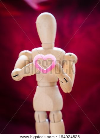 Still Life Wooden Puppet And Pink Heart.