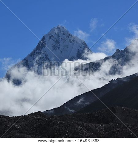 Autumn scene in the Everest National Park Nepal. Mount Taboche Peak. Fog.