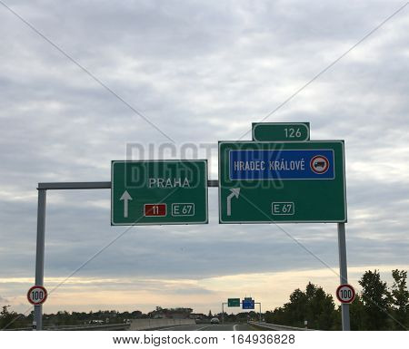 Highway Sign With Directions To Reach The City Of Prague
