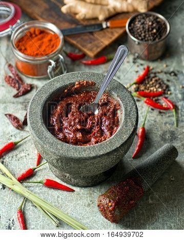 A delicious Thai red curry paste with mortar and pestle.