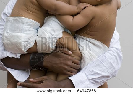 Stessed dad with his hands full isolated on white.
