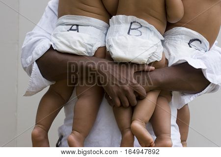Stessed dad with his hands full isolated on white.
