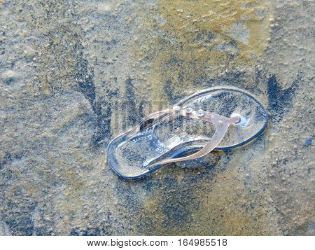one piece of a kid's slipper, at juhu beach mumbai India